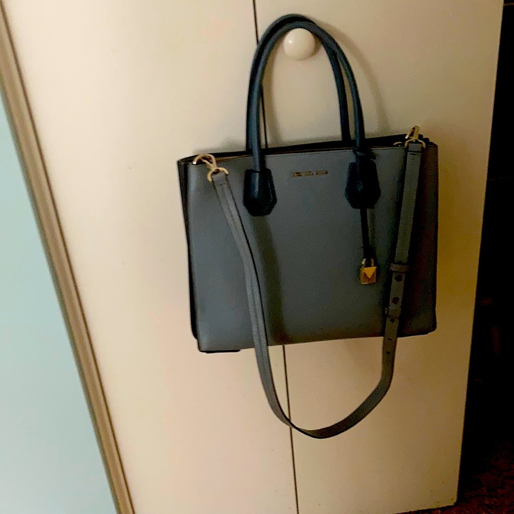 Michael Kors purse in blue with two toned edges.  In good condition!